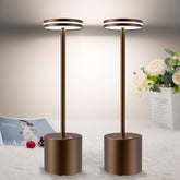 Two modern floor lamps with circular tops on a light background